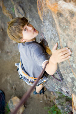 Scout rock climbing